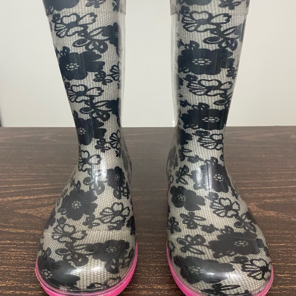 Pink and black rain boots.